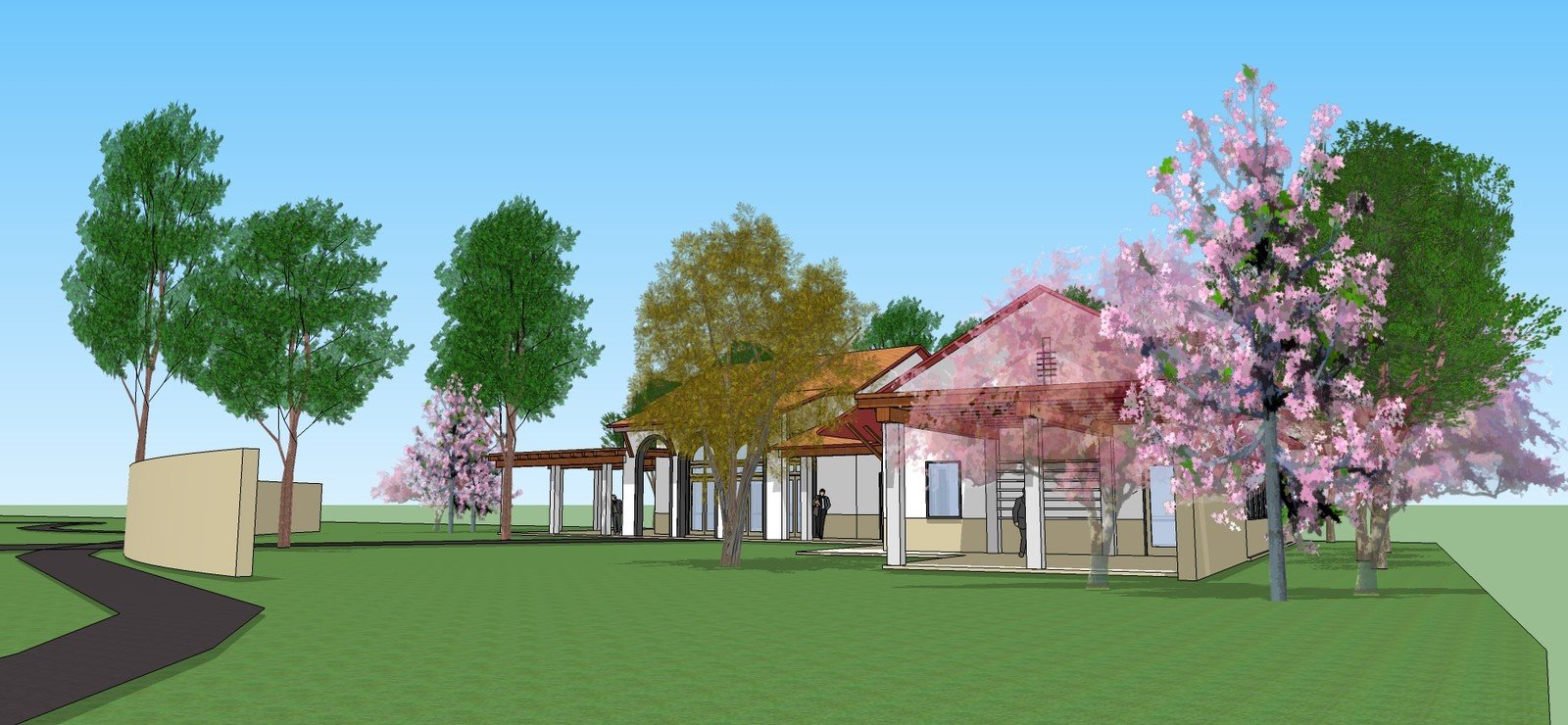 School campus model viewed past flowering trees