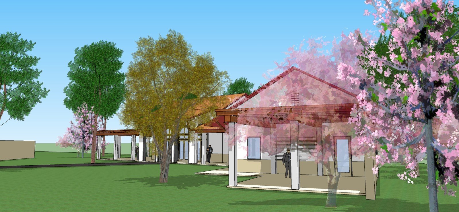 Side view of the school campus model through landscaped grounds
